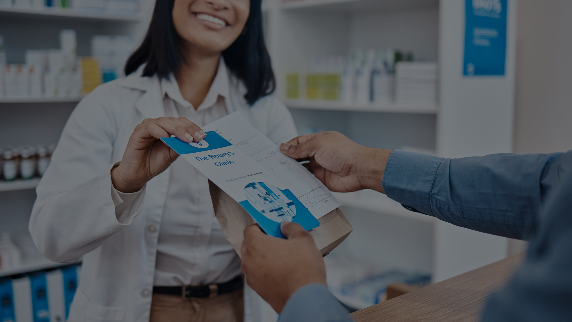 Pharmacist handing person their medicine