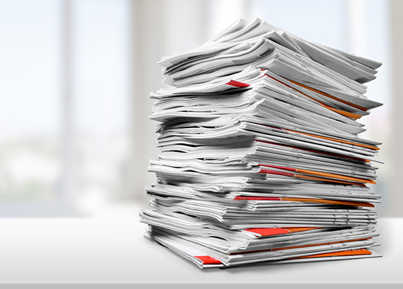 Business Process Optimization | Image of a large stack of papers