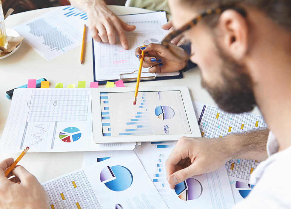 People working together with papers scattered on the table