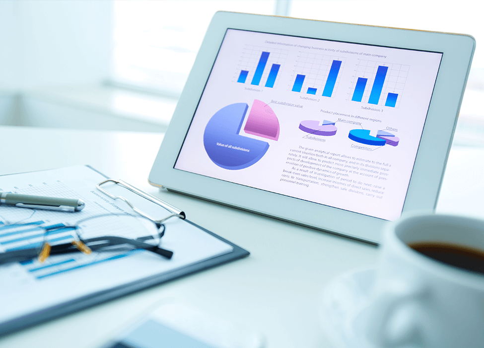 A tablet showing pie charts and bar graphs, emphasizing the role of data science and statistics in business analytics and decision-making processes.