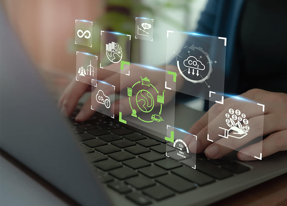 A person working on a laptop displaying various sustainability infographics, emphasizing sustainable business practices in reducing CO2 emissions and promoting eco-friendly innovations.